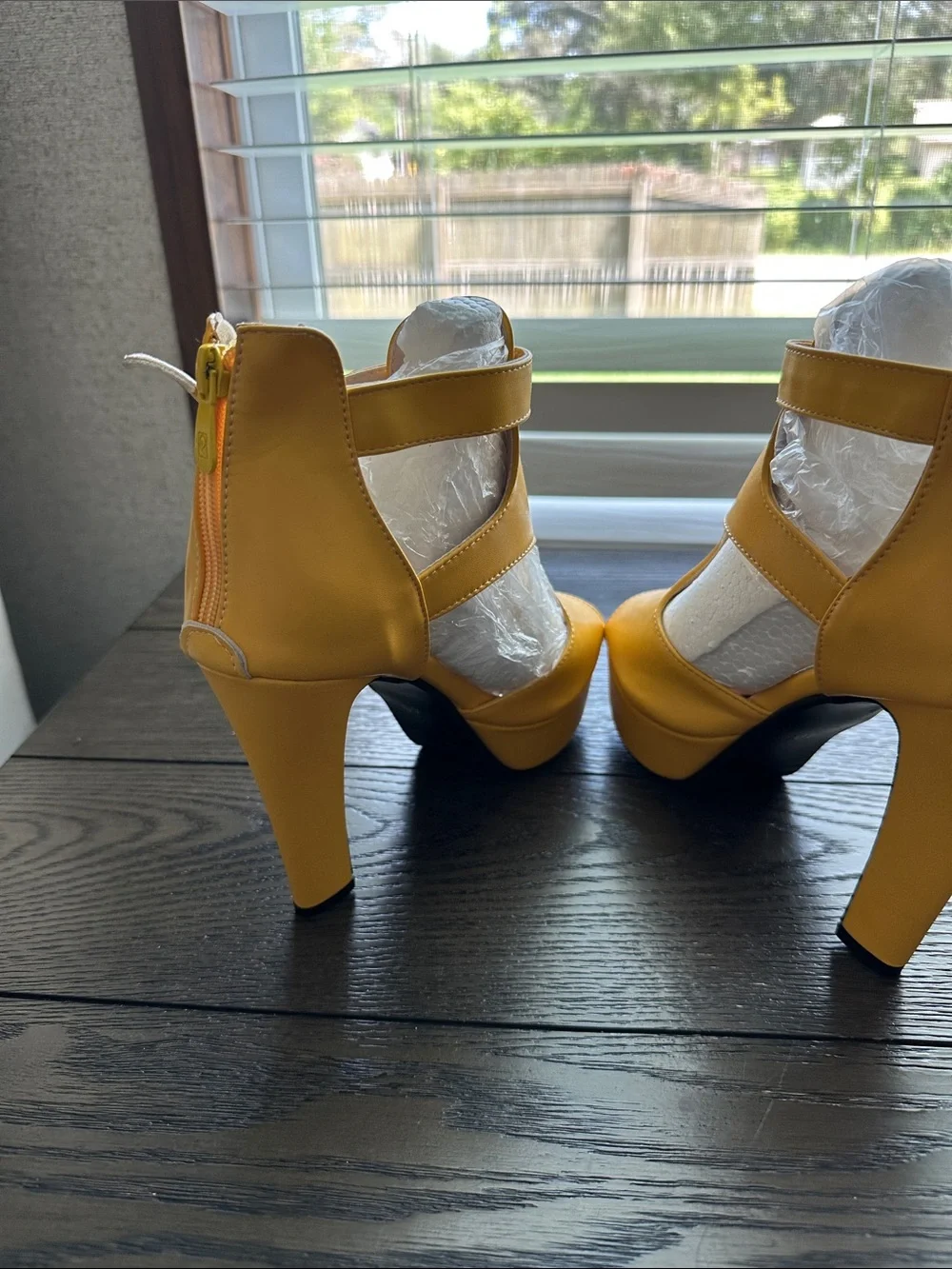 Fereshte mustard yellow peep toe high heel ankle booties.